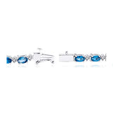 .925 Sterling Silver Oval Genuine London Blue Topaz and Diamond Accent Tennis Bracelet, 7-1/4"